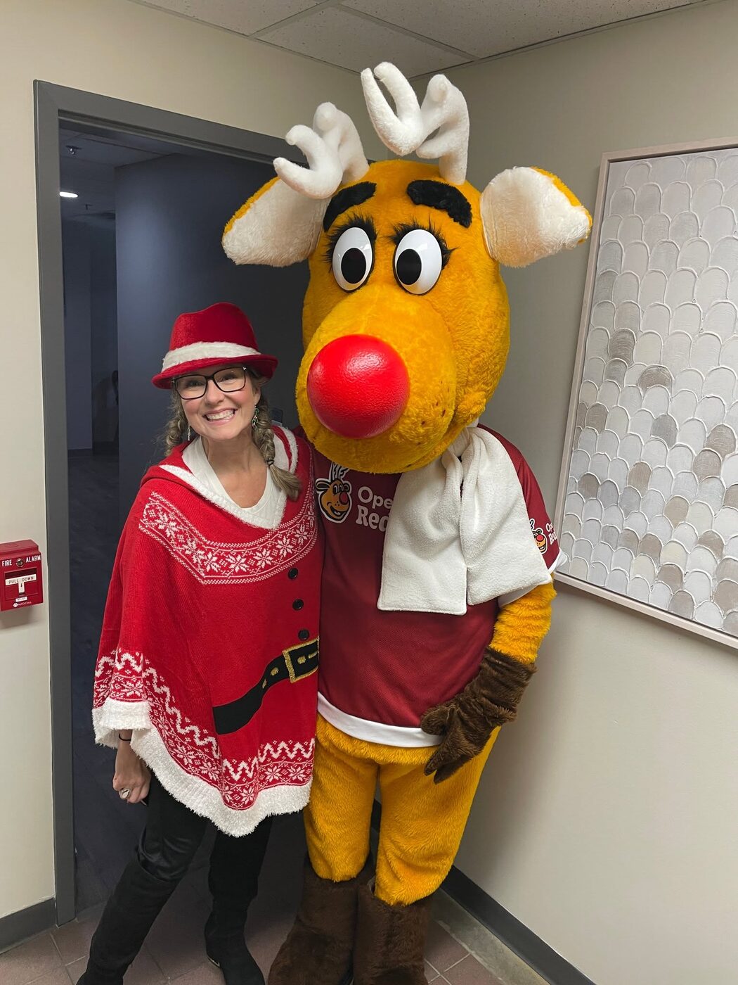 Rudy with an Operation Red Nose volunteer, both in team colours.